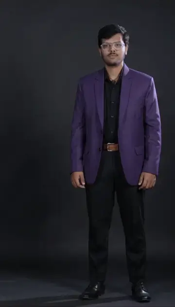 Vignesh B S walking in a purple blazer